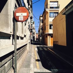 Road amidst buildings in city