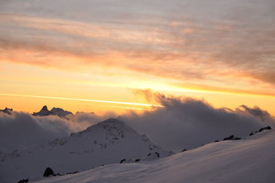 Scenic view of mountains against sky during sunset