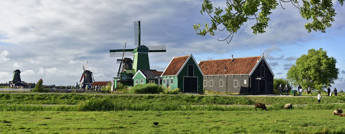 House on field against sky