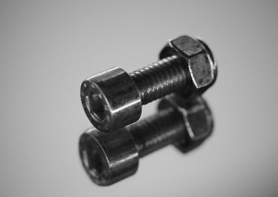 Close-up of machine part over white background