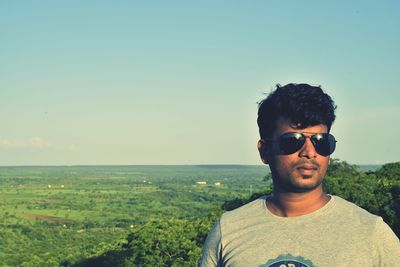 Close-up of young man against clear sky