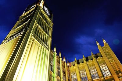 Low angle view of illuminated buildings against sky