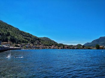 Scenic view of sea against clear blue sky