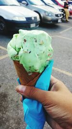 Close-up of woman holding ice cream cone