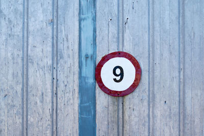 Number 9 on wooden wall