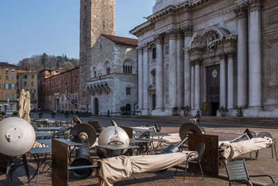 Empty tables outside a bar at paolo vi square in brescia after italy's government lockdown