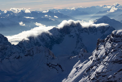 Scenic view of snowcapped mountains against sky