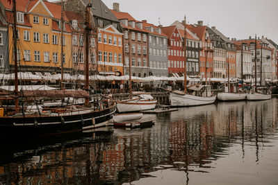 Boats moored at harbor