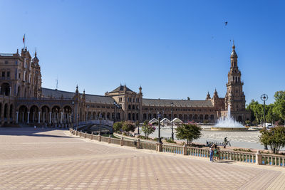 Buildings in town against sky