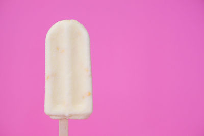 Close-up of ice cream against pink background