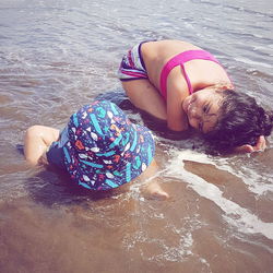 Woman lying on beach