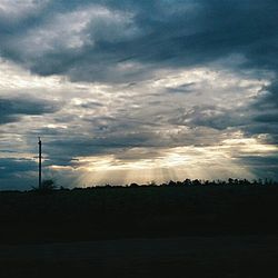 Scenic view of dramatic sky over landscape