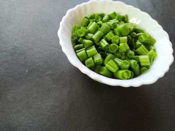 High angle view of chopped vegetables in bowl on table