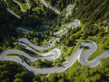 Aerial image of cars on maloja mountain pass road, engadin, switzerland