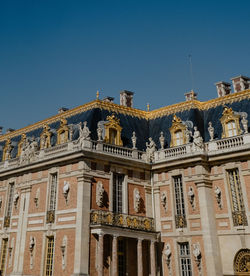 Low angle view of building against blue sky