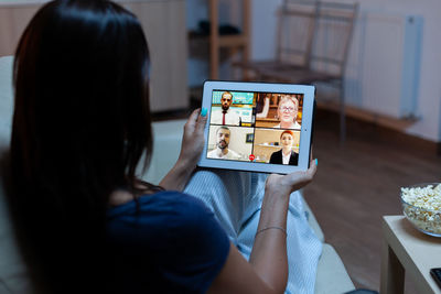 Midsection of woman using mobile phone