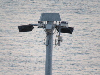 Close-up of camera on sea shore