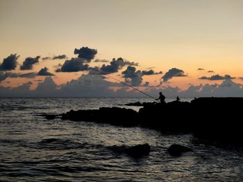 Scenic view of sea against sky during sunset