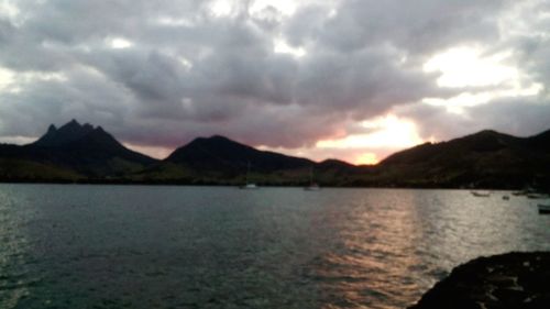 Scenic view of lake against cloudy sky