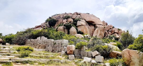 Low angle view of rocks against sky