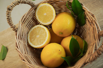 High angle view of fruits in basket on table