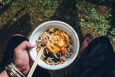 High angle view of person holding food