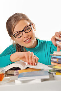 Portrait of a smiling young woman studying