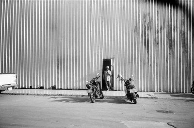 High angle view of people walking on street with black and white film