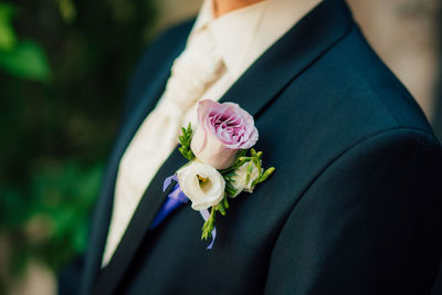 Close-up of woman holding rose bouquet