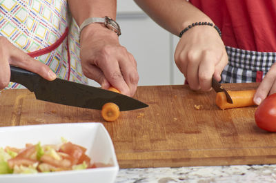 Midsection of man preparing food on table