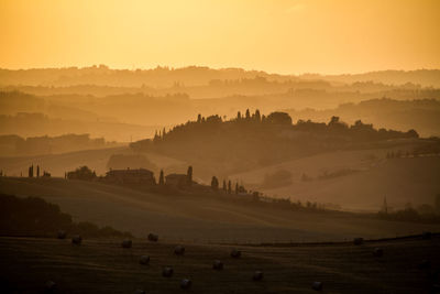 Scenic view of landscape against sky during sunset