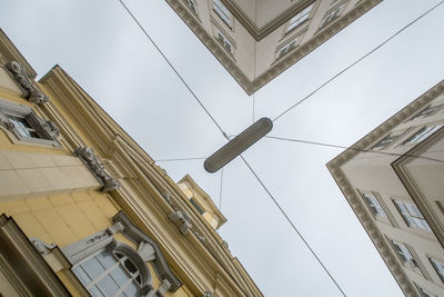 Low angle view of buildings in city against sky