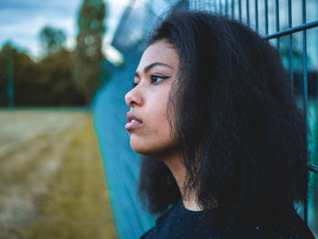 Portrait of young woman looking away