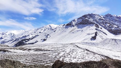 Scenic view of snowcapped mountains against sky