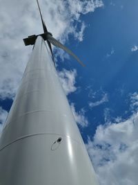 Low angle view of airplane flying against sky