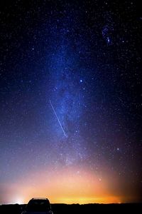 Low angle view of silhouette stars against sky at night