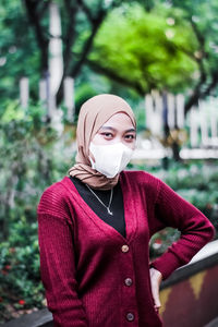 Portrait of a young woman wearing a mask