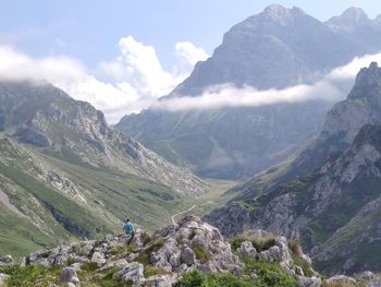 Scenic view of mountains against cloudy sky