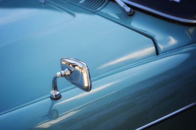 Close-up of mirror on car