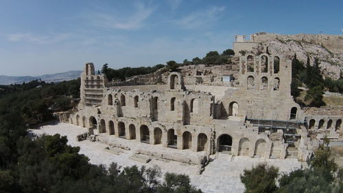 Abandoned amphitheater against blue sky