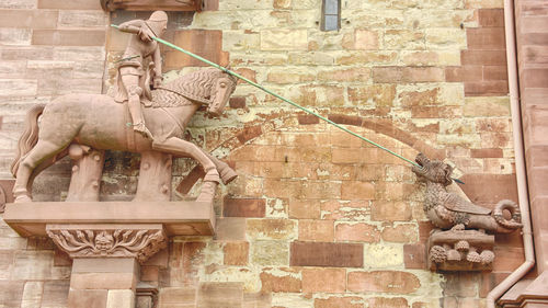 Statue in front of historical building