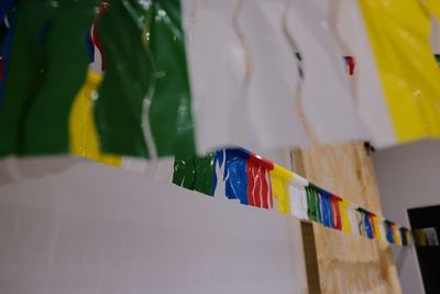 Close-up of colorful flags hanging