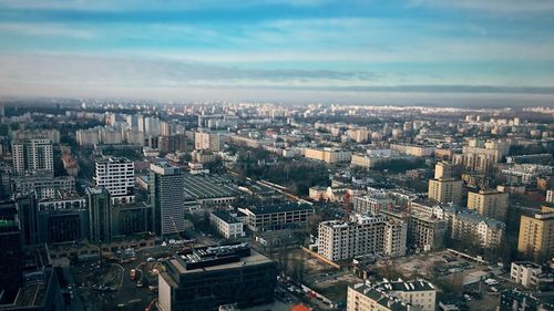 High angle view of modern buildings in city against sky