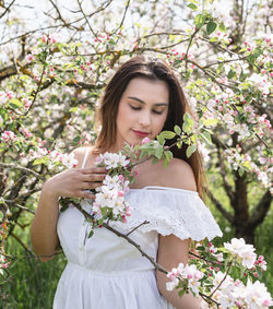 Portrait of young woman with bouquet