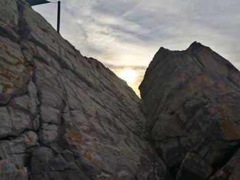 Low angle view of rock formations against sky