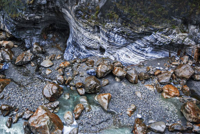 High angle view of water flowing through rocks