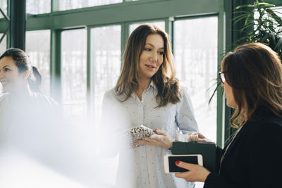 Mature businesswomen discussing in meeting at office