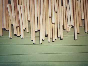 High angle view of breadsticks on table