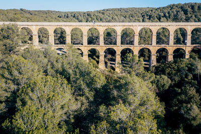 High angle view of les ferreres aqueduct against clear sky