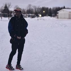 People standing on snow covered landscape